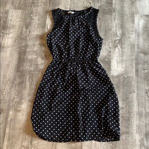 Black and white polka dotted sleeveless dress